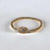 Pulsera bolitas ojo chico azul resorte